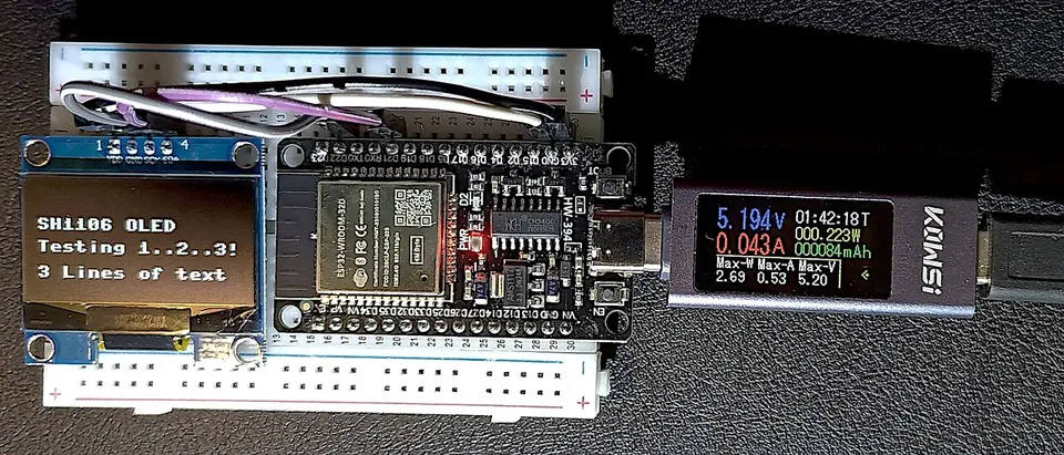 ESP32 dev board connected to an SH1106 OLED display on a breadboard, powered via USB