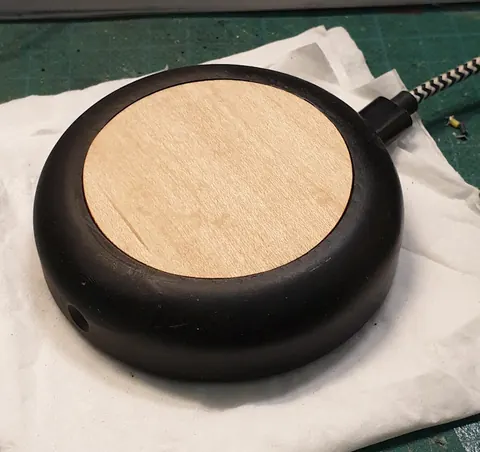 VoicePuck with a thin wood veneer cover that lets the WS2812B LEDs shine through