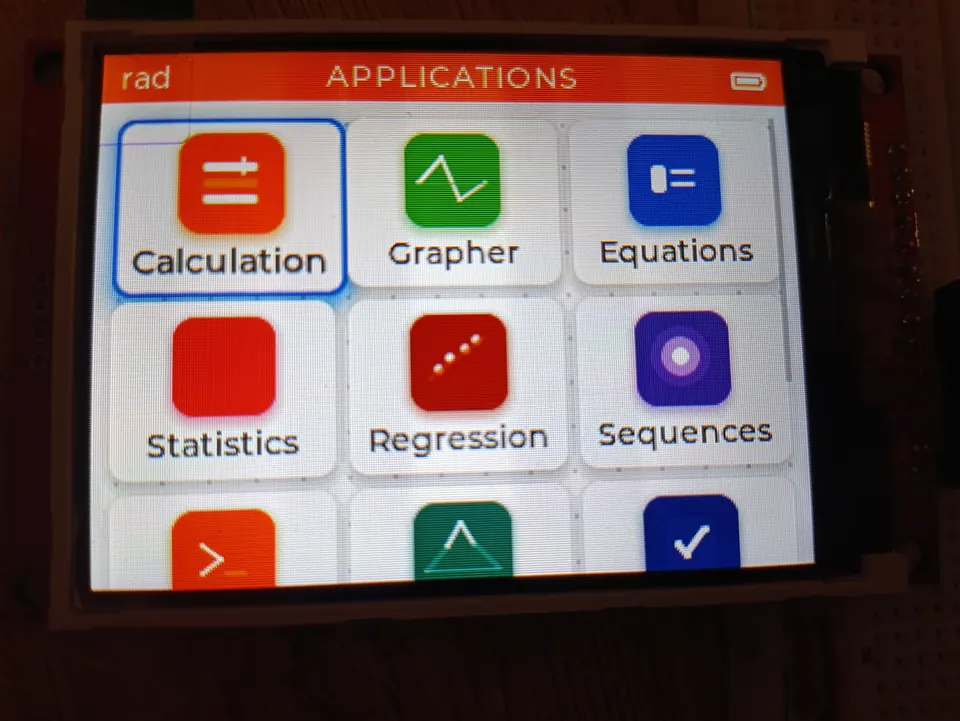 NumOS launcher showing the app grid on the ILI9341 IPS display