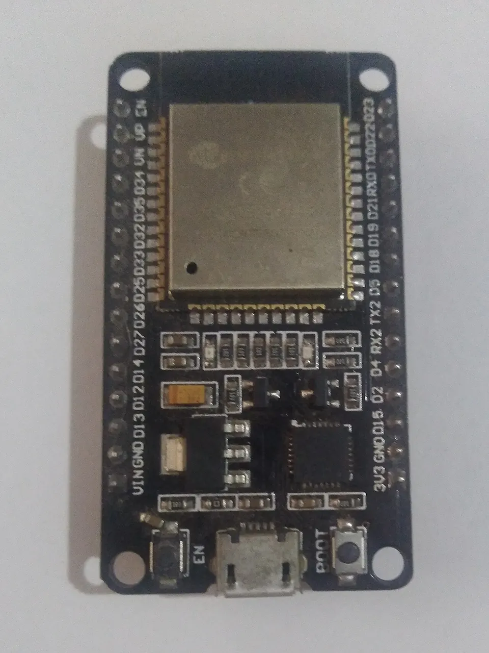 An ESP32 microcontroller — the chip includes both Wi-Fi and Bluetooth radios on a single SoC.