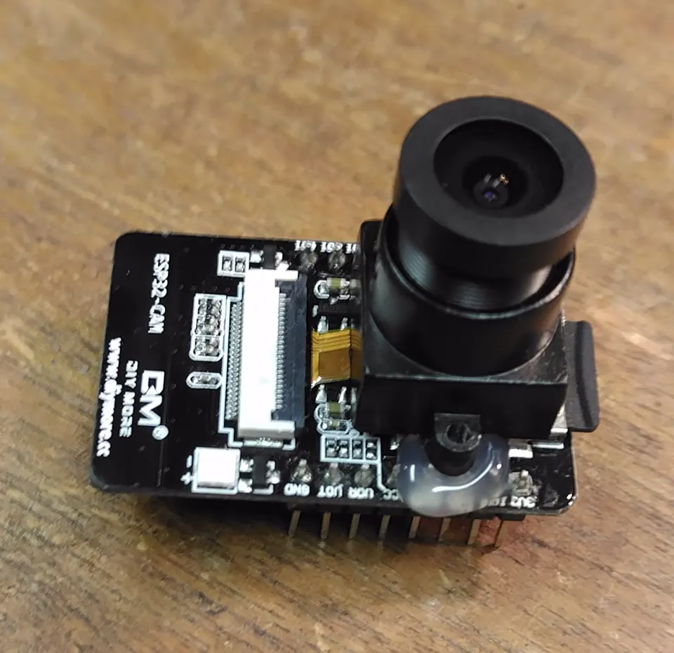 An ESP32-CAM with its original lens casing removed, ready for a replacement M12 lens mount.